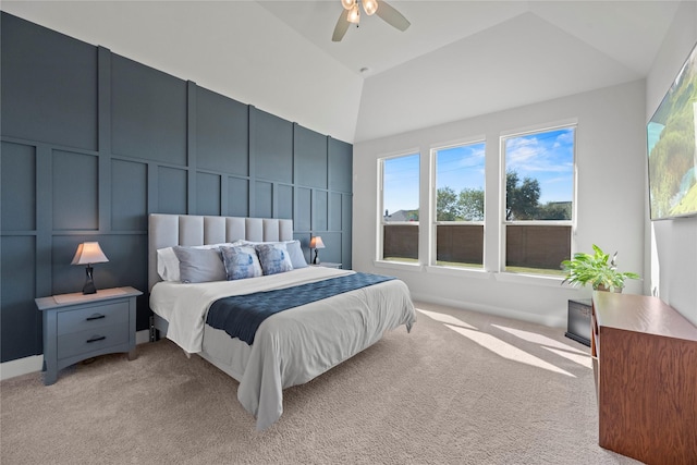 carpeted bedroom featuring vaulted ceiling and ceiling fan