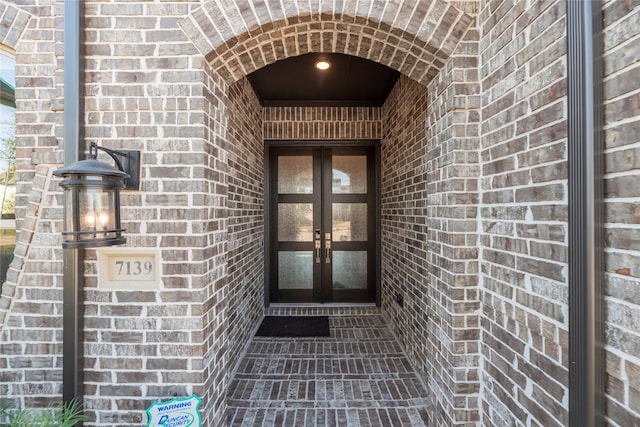 property entrance featuring french doors