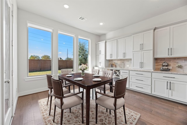 dining room with hardwood / wood-style flooring