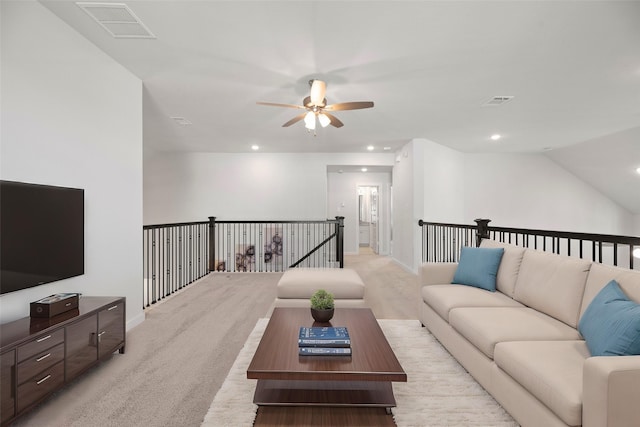 living room featuring ceiling fan and vaulted ceiling