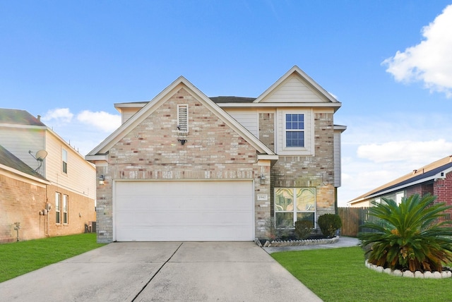 view of front of home with a garage and a front lawn