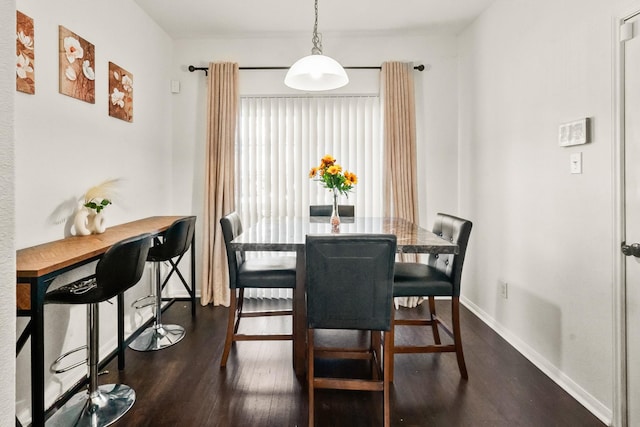 dining area featuring dark hardwood / wood-style flooring