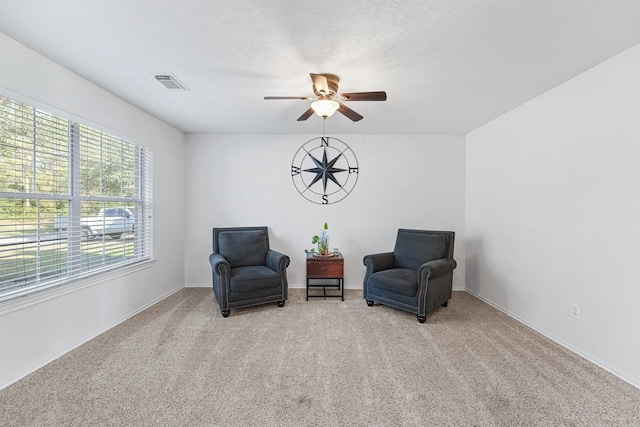 sitting room with light carpet and ceiling fan