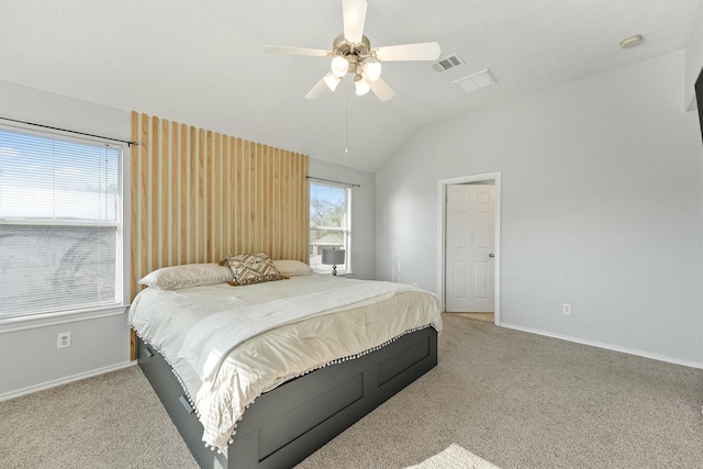 bedroom with carpet flooring, ceiling fan, and vaulted ceiling