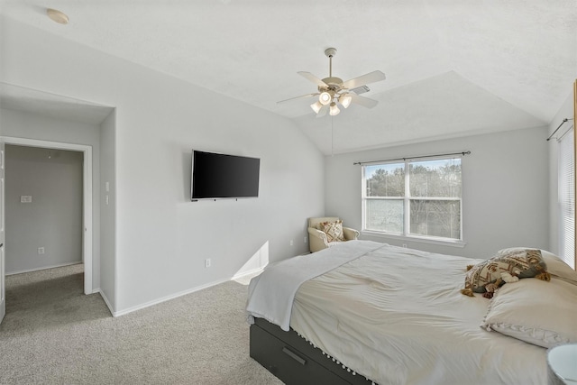 bedroom with carpet, ceiling fan, and lofted ceiling