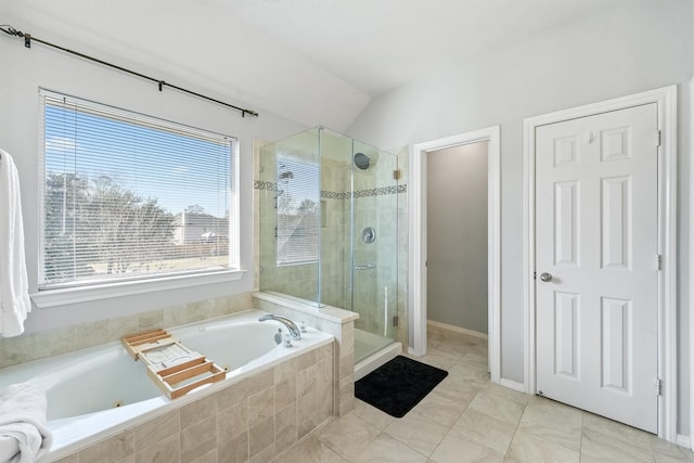 bathroom featuring separate shower and tub, tile patterned flooring, and vaulted ceiling