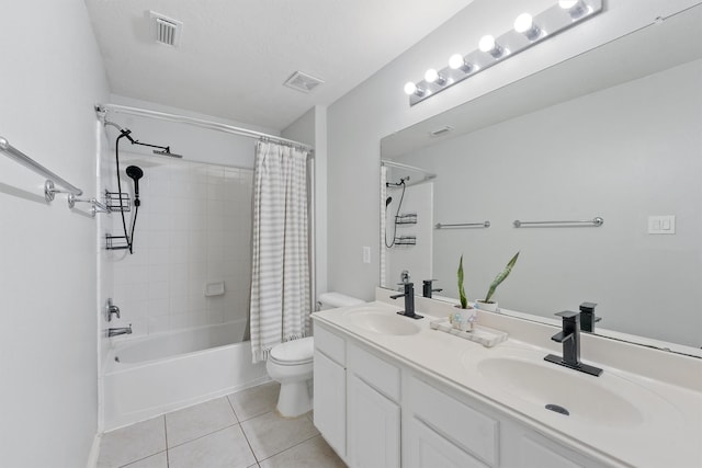 full bathroom featuring shower / bath combo, vanity, tile patterned floors, toilet, and a textured ceiling