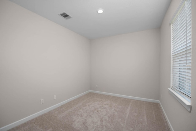 empty room featuring carpet floors