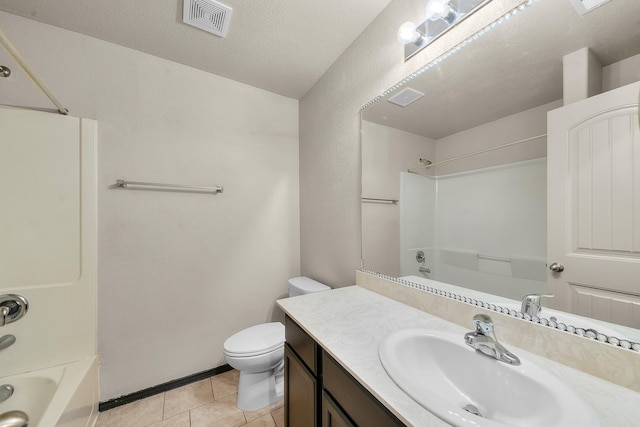 full bathroom with vanity, tile patterned flooring, toilet, a textured ceiling, and shower / bath combination