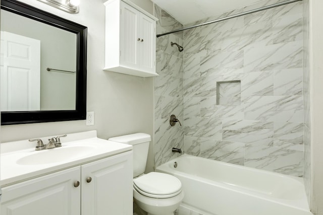 full bathroom with vanity, tiled shower / bath combo, and toilet