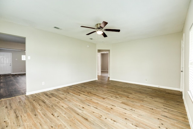 spare room featuring ceiling fan and light hardwood / wood-style floors