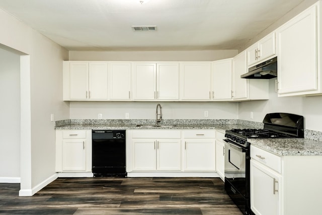 kitchen featuring light stone counters, sink, white cabinets, and black appliances