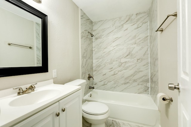 full bathroom with tiled shower / bath combo, toilet, and vanity