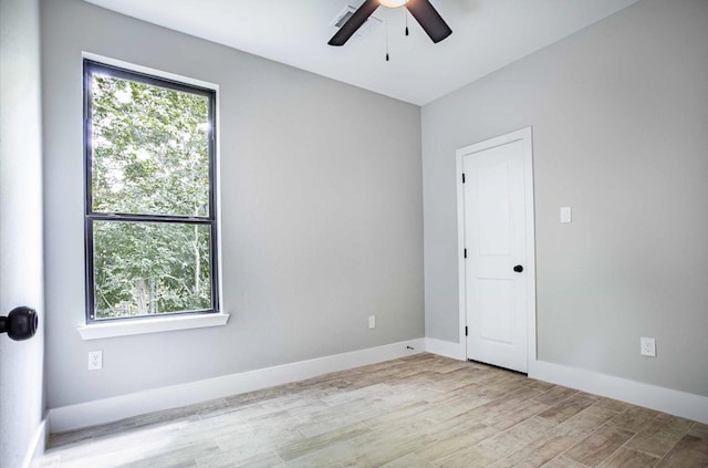 unfurnished room featuring ceiling fan and light hardwood / wood-style floors