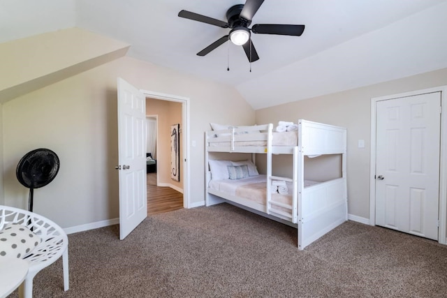 bedroom featuring carpet flooring, ceiling fan, and vaulted ceiling