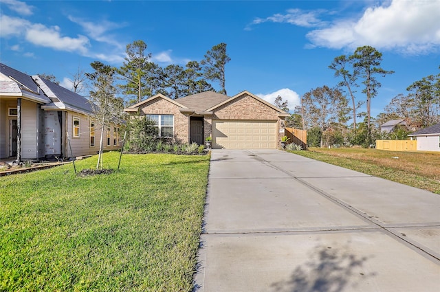 view of front of house with a garage and a front lawn