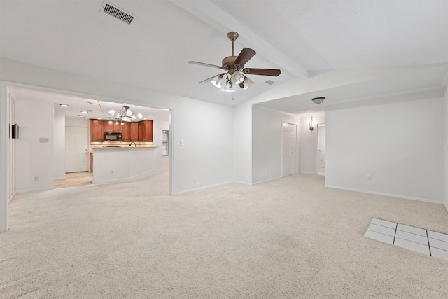 unfurnished living room featuring light colored carpet, lofted ceiling with beams, and ceiling fan with notable chandelier