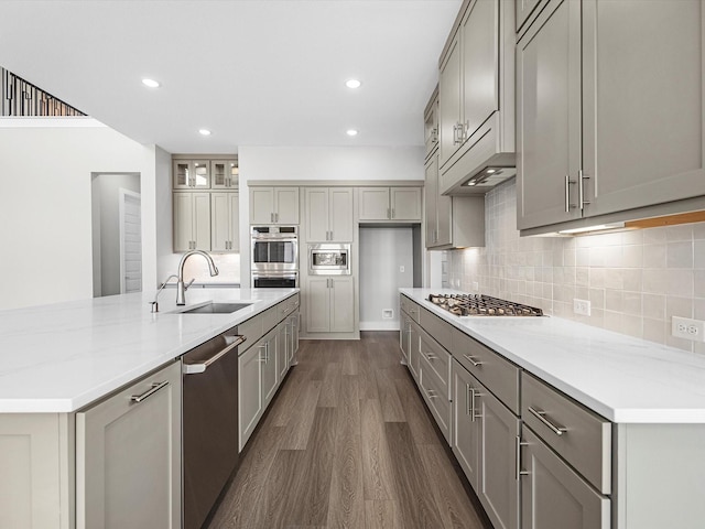 kitchen featuring gray cabinets, sink, stainless steel appliances, and dark hardwood / wood-style floors