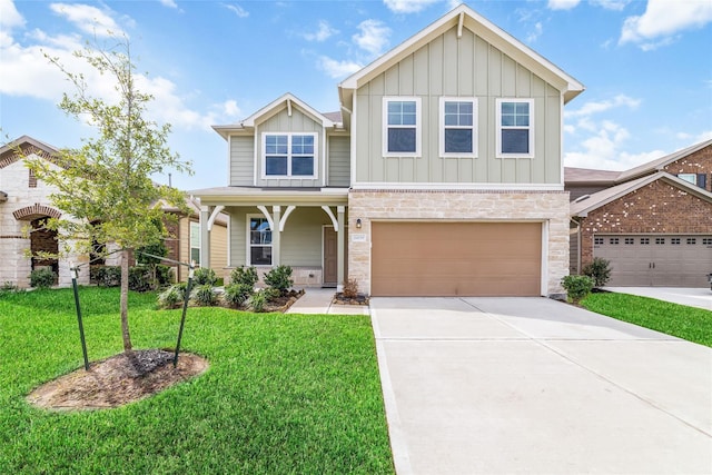 craftsman inspired home featuring a front yard and a garage