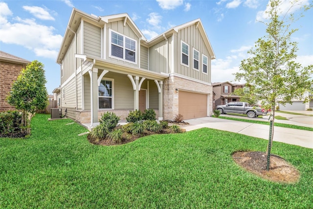 view of front of home with central AC unit, a garage, and a front lawn