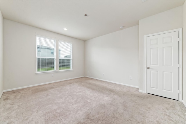 empty room with light colored carpet