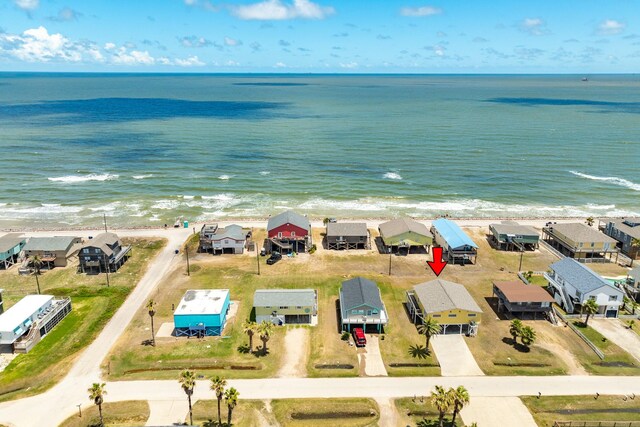 aerial view featuring a water view and a view of the beach