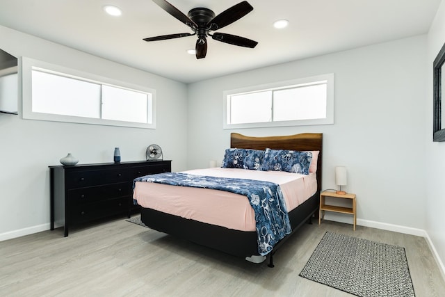 bedroom featuring hardwood / wood-style floors and ceiling fan