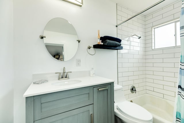 full bathroom featuring shower / tub combo with curtain, vanity, and toilet