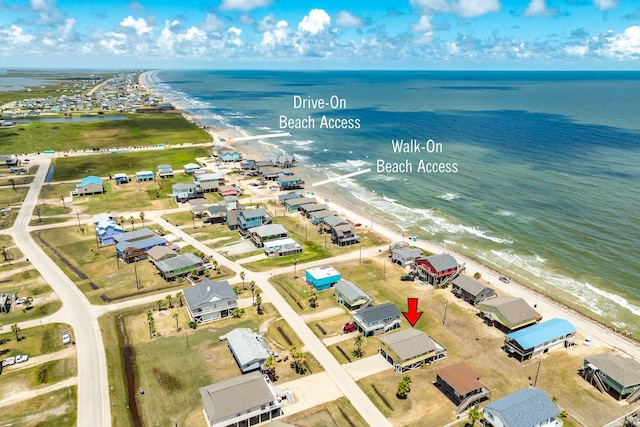 bird's eye view with a water view and a view of the beach