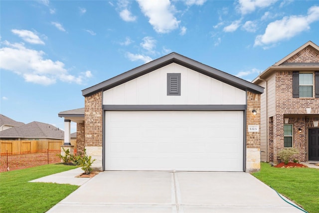 view of front facade with a front lawn and a garage