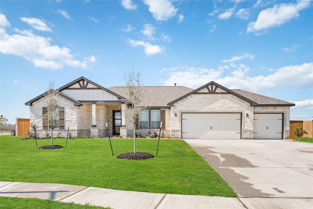 view of front facade featuring an attached garage, fence, concrete driveway, and a front yard