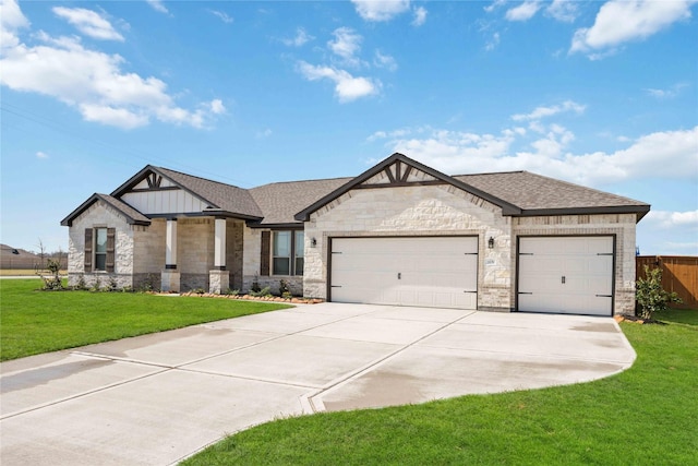 view of front of property featuring an attached garage, a shingled roof, concrete driveway, and a front yard