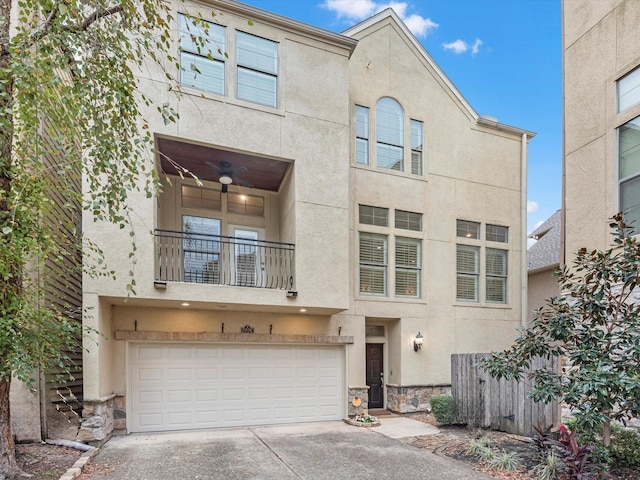 view of front of home with ceiling fan and a garage