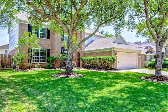 view of front of home with a garage and a front lawn