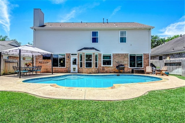 view of swimming pool featuring a gazebo, grilling area, a yard, and a patio