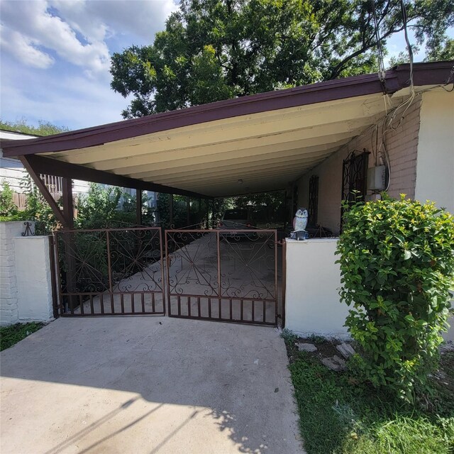 view of gate with a carport