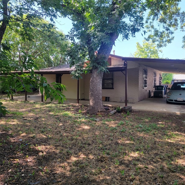 view of side of home featuring a carport