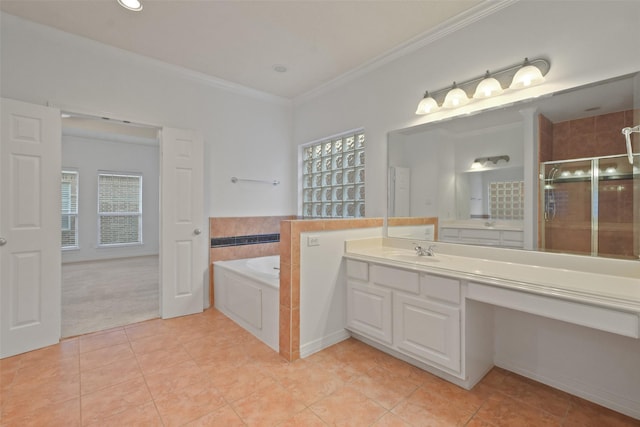 bathroom with vanity, tile patterned floors, crown molding, separate shower and tub, and a fireplace