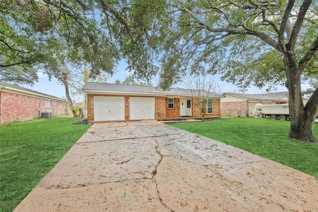 single story home featuring central AC, a front lawn, and a garage