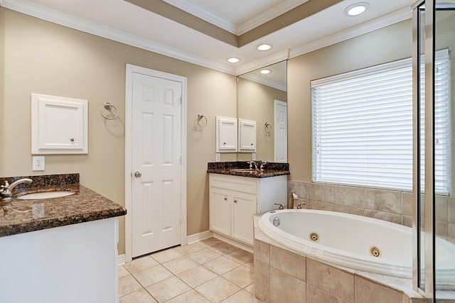 bathroom featuring vanity, tile patterned floors, crown molding, and tiled tub