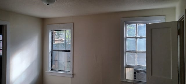 entryway with a textured ceiling