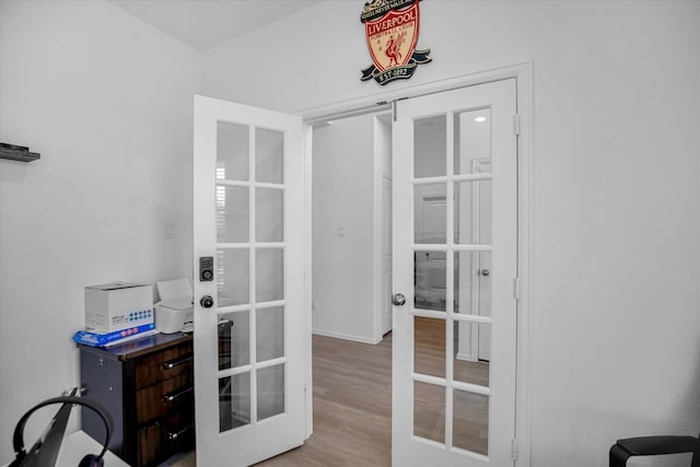 office area with french doors and light wood-type flooring