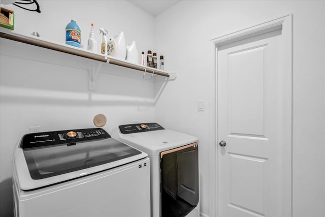 washroom featuring independent washer and dryer