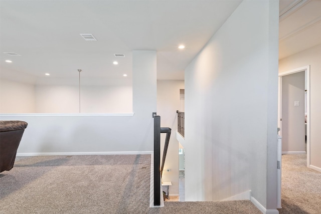 hallway with carpet floors