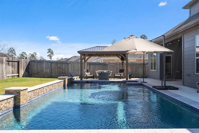 view of pool with a patio, an outdoor hangout area, and a gazebo