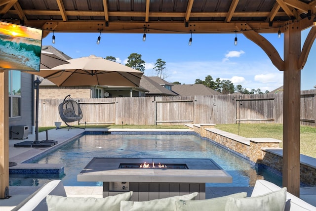 view of pool featuring an outdoor fire pit and a gazebo