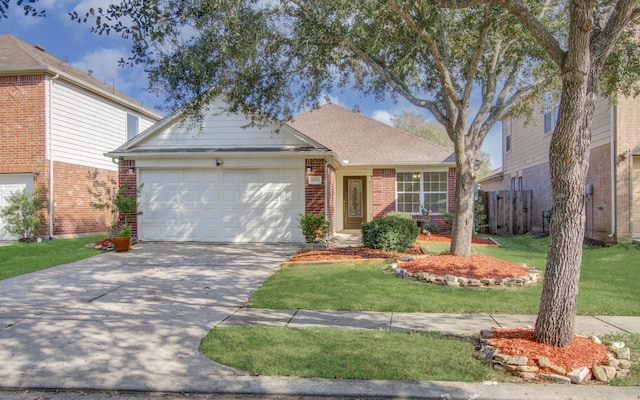 view of front facade with a front yard and a garage