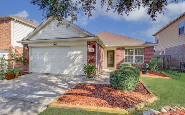 view of front of house with a garage and a front yard