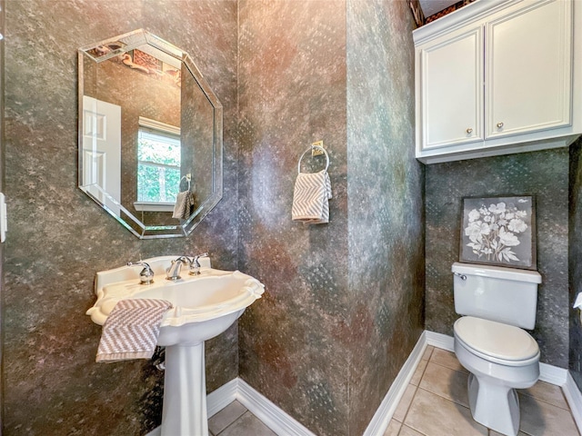 bathroom featuring tile patterned floors and toilet