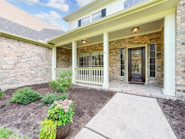 property entrance featuring covered porch